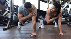 Toning Bingo Wings: Your Ultimate Guide to Sculpting Sleek Arms at the Gym 3 Fitness trainer demonstrating arm toning exercises Leicestershire