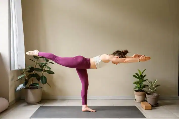 Woman doing Yoga exercise Leicestershire to help with toning the body. 