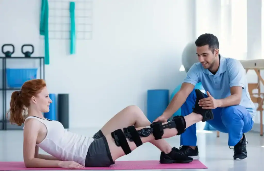 Woman having treatment to help muscle recovery Leicestershire after an injury